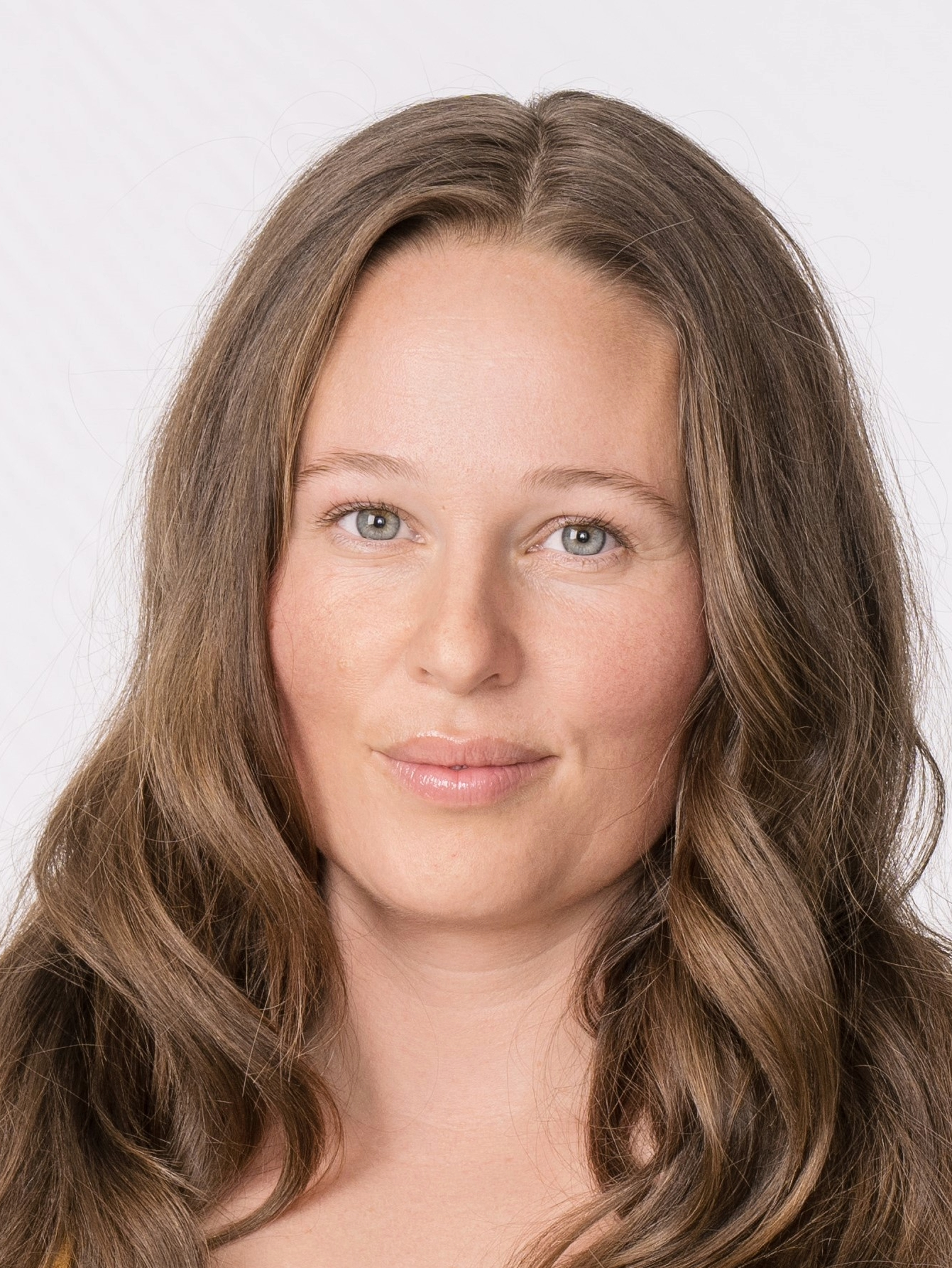 Woman white long brown hair and a white background.