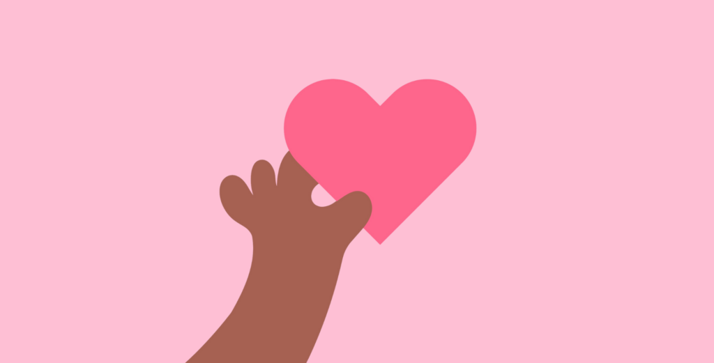 Cartoon hand holding bright pink heart on light pink background representing loving-kindness meditation.