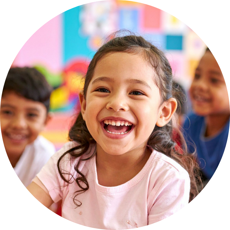 A happy girl, smiling after using mindfulness for schools