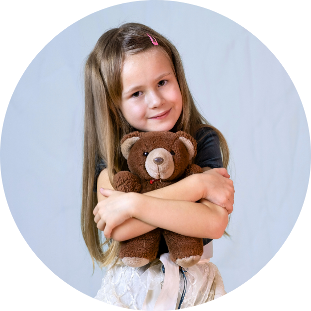 Girl holding teddy bear